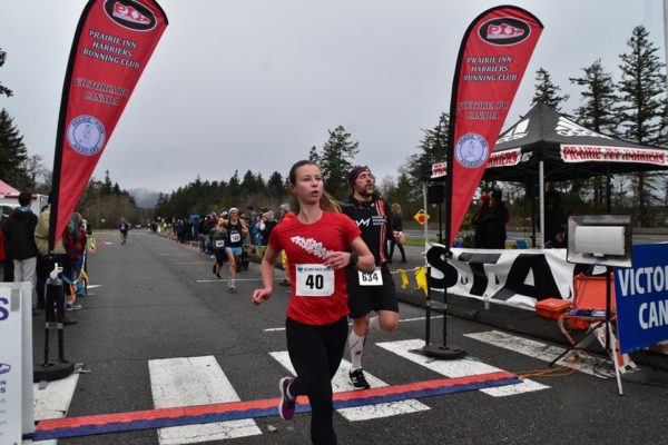 Crossing the finish line at the Harriers Pioneer 8k race