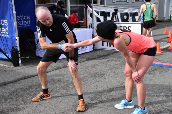 After crossing the finish line with at the Harriers Pioneer 8k 2022. Photo by Joseph Camilleri.