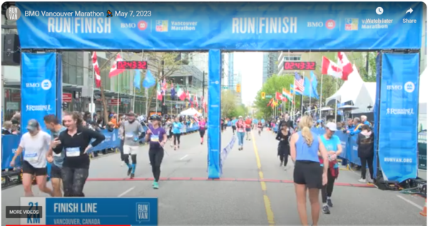 Crossing the finish line of the BMO Vancouver Half Marathon 2023